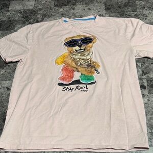 Stay Real Men's Graphic Tee in Light Pink